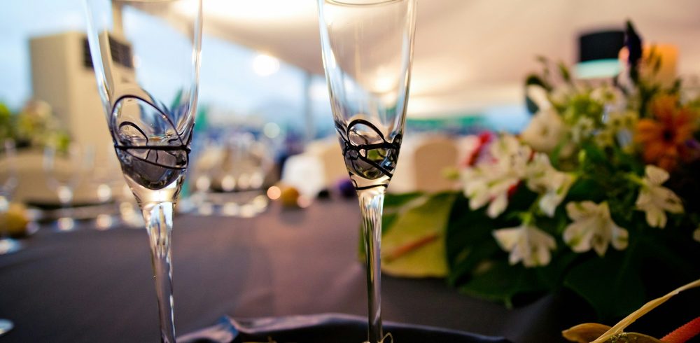 Pair of glasses prepared for the toast with champagne at an event.